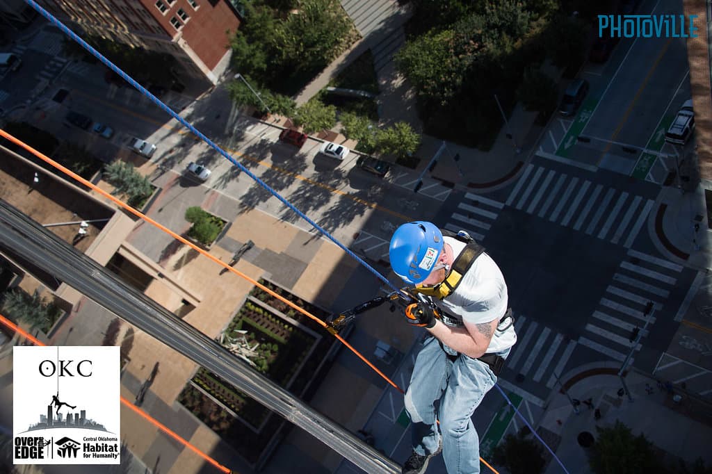 Michael Bricker rappelling during an Over the Edge event