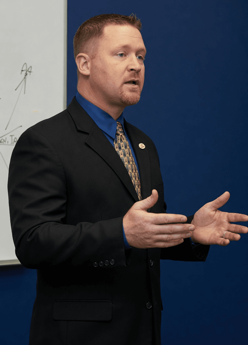 Michael Bricker teaching an insurance education seminar