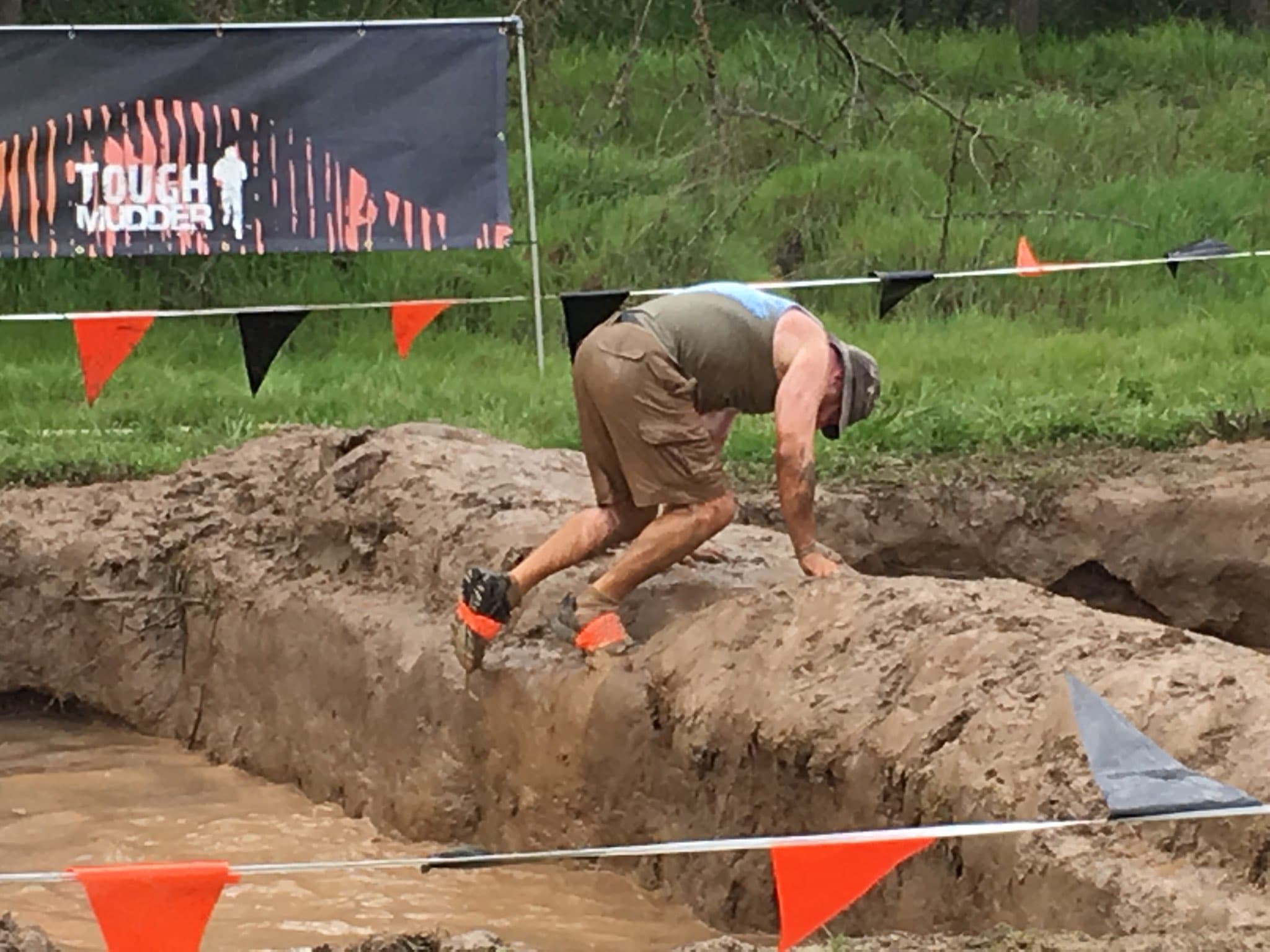Michael Bricker completing a Tough Mudder obstacle